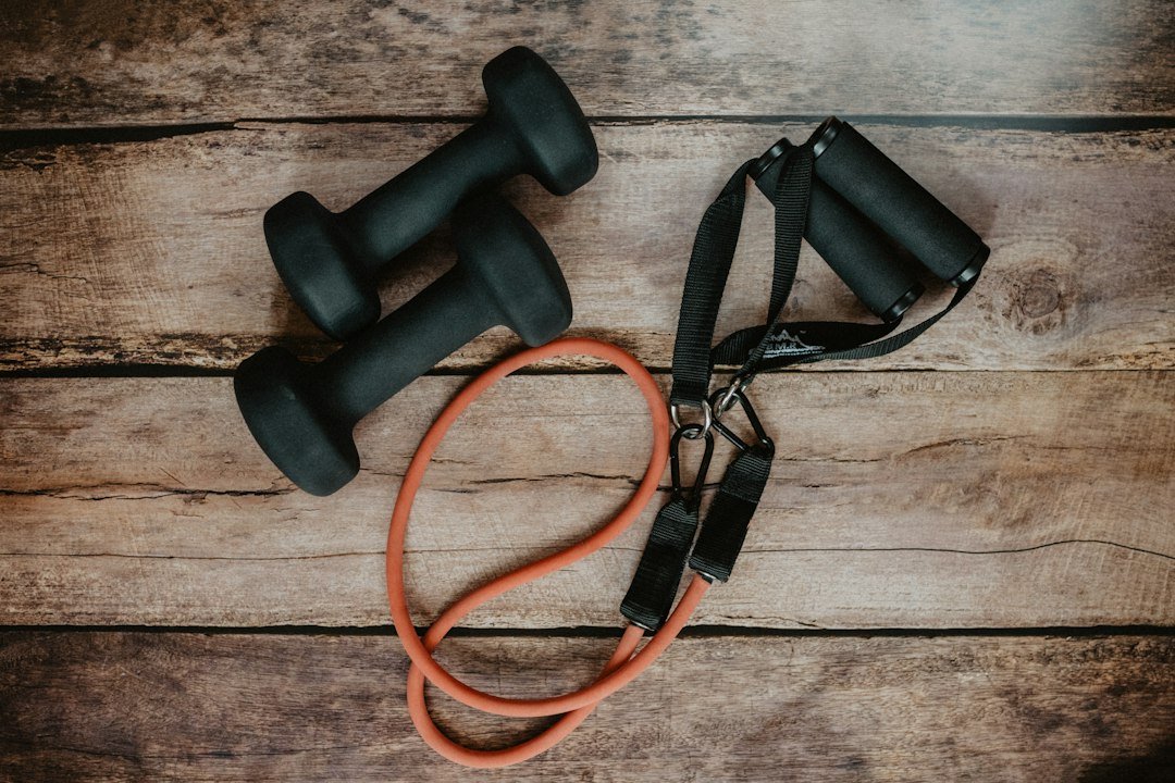 Nolensville Packing: Home Gym Preparation Questions 3 Dumbbells and resistance band organized as small home gym accessories