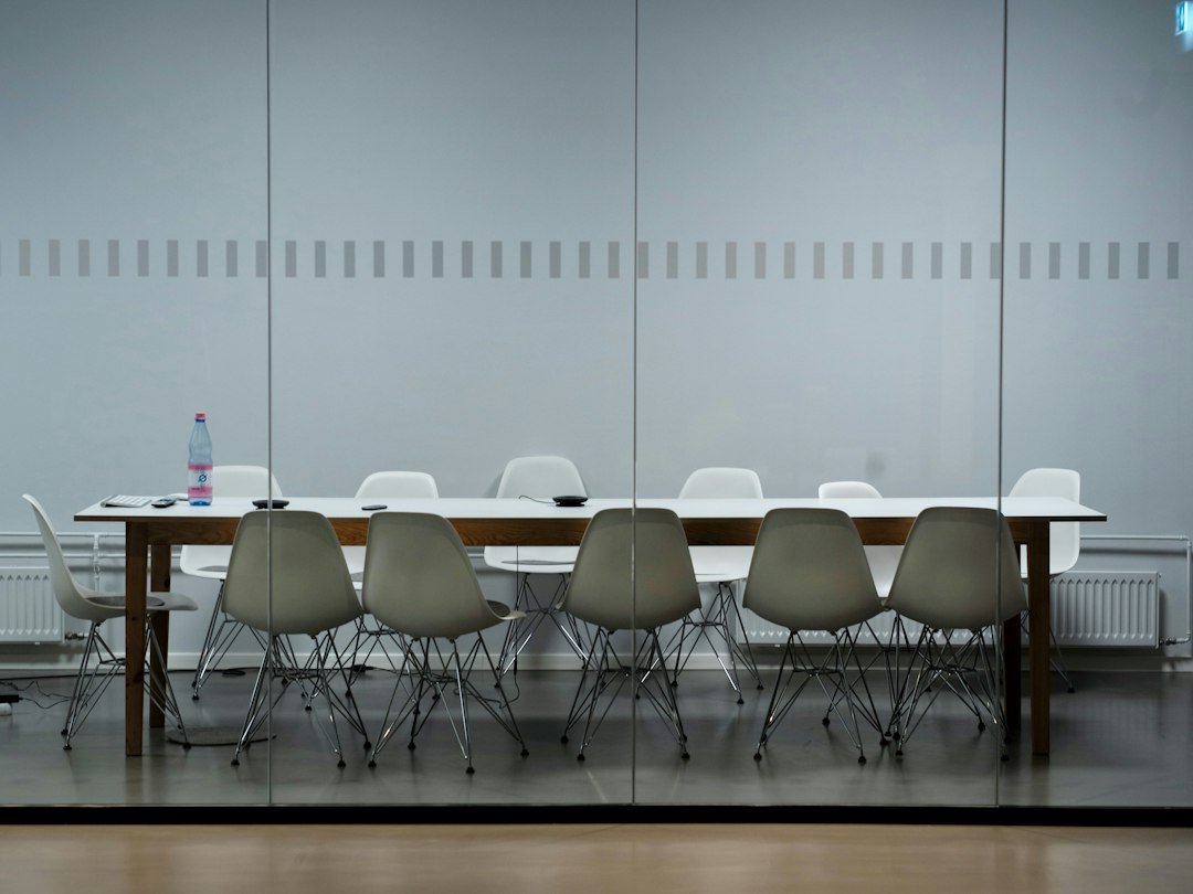 Murfreesboro Packing: Conference-Room Asset Labels 31 Conference table and white chairs behind a glass wall