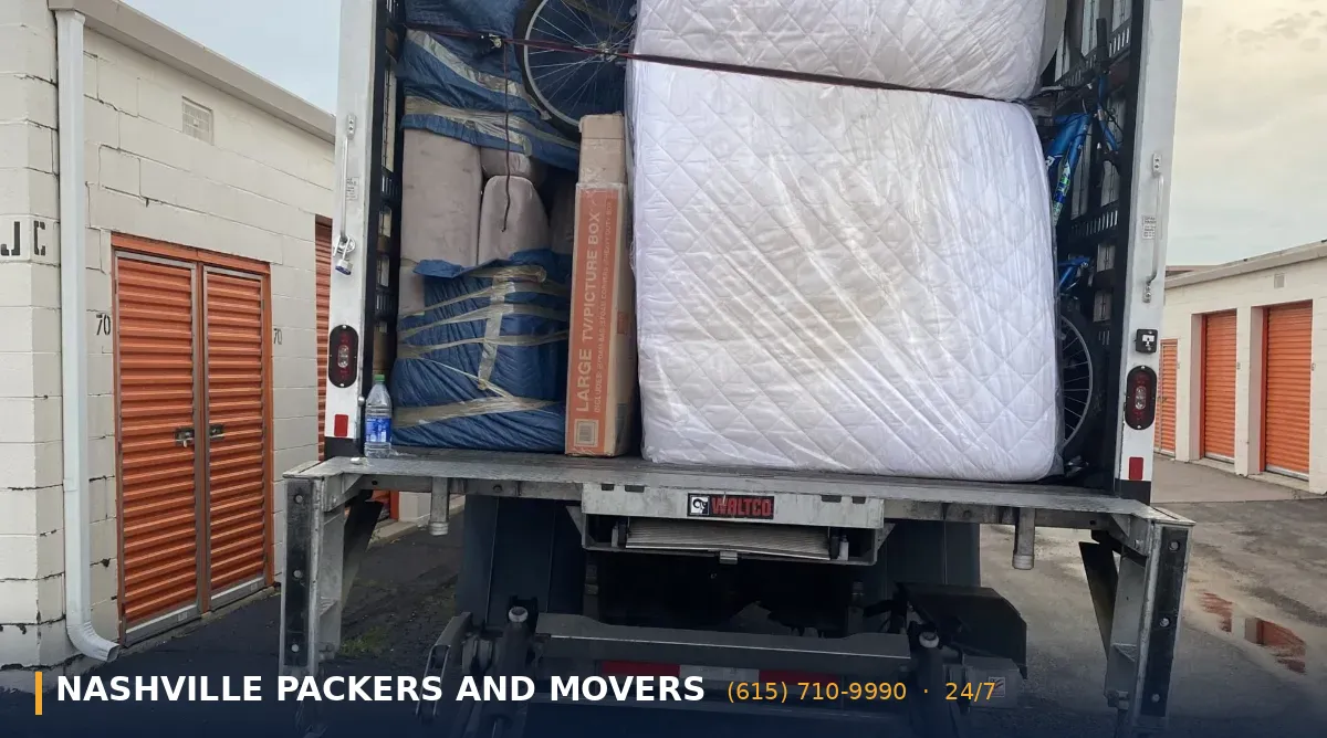 Movers providing packing help with labeled boxes