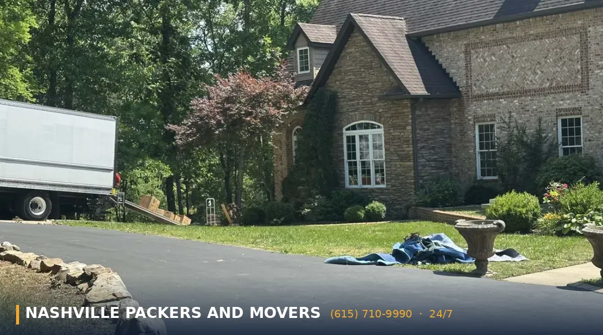 Belle Meade Packers and Movers 2 Belle Meade packers and movers truck parked at a stone estate home during a move