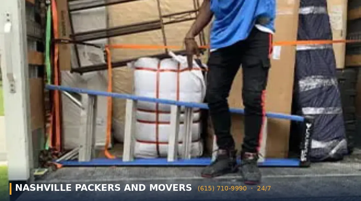 How to Pack for a Move in Nashville TN: 2026 Packing Guide 6 Residential moving crew handling labeled boxes on moving day