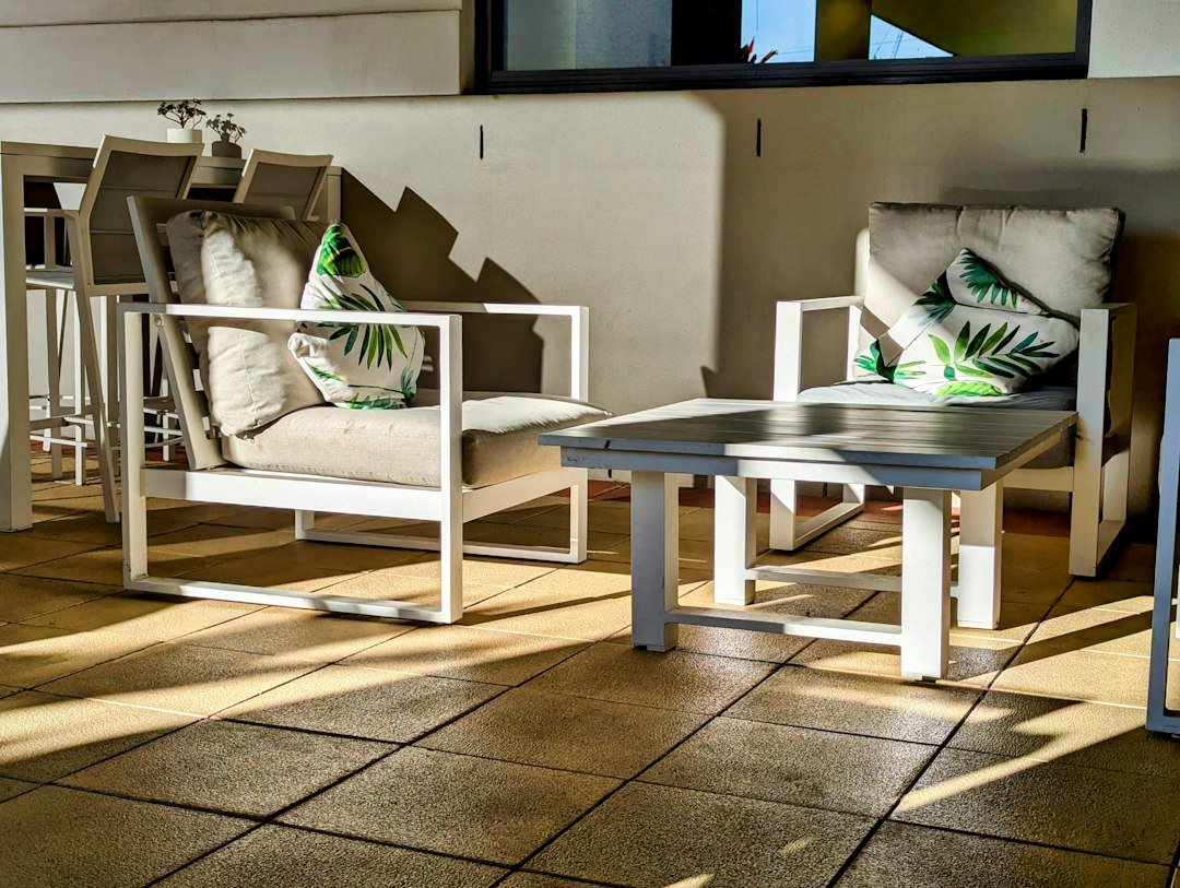 Fairview Packing: Patio Furniture and Outdoor Accessories 3 Patio chairs and cushions around an outdoor table
